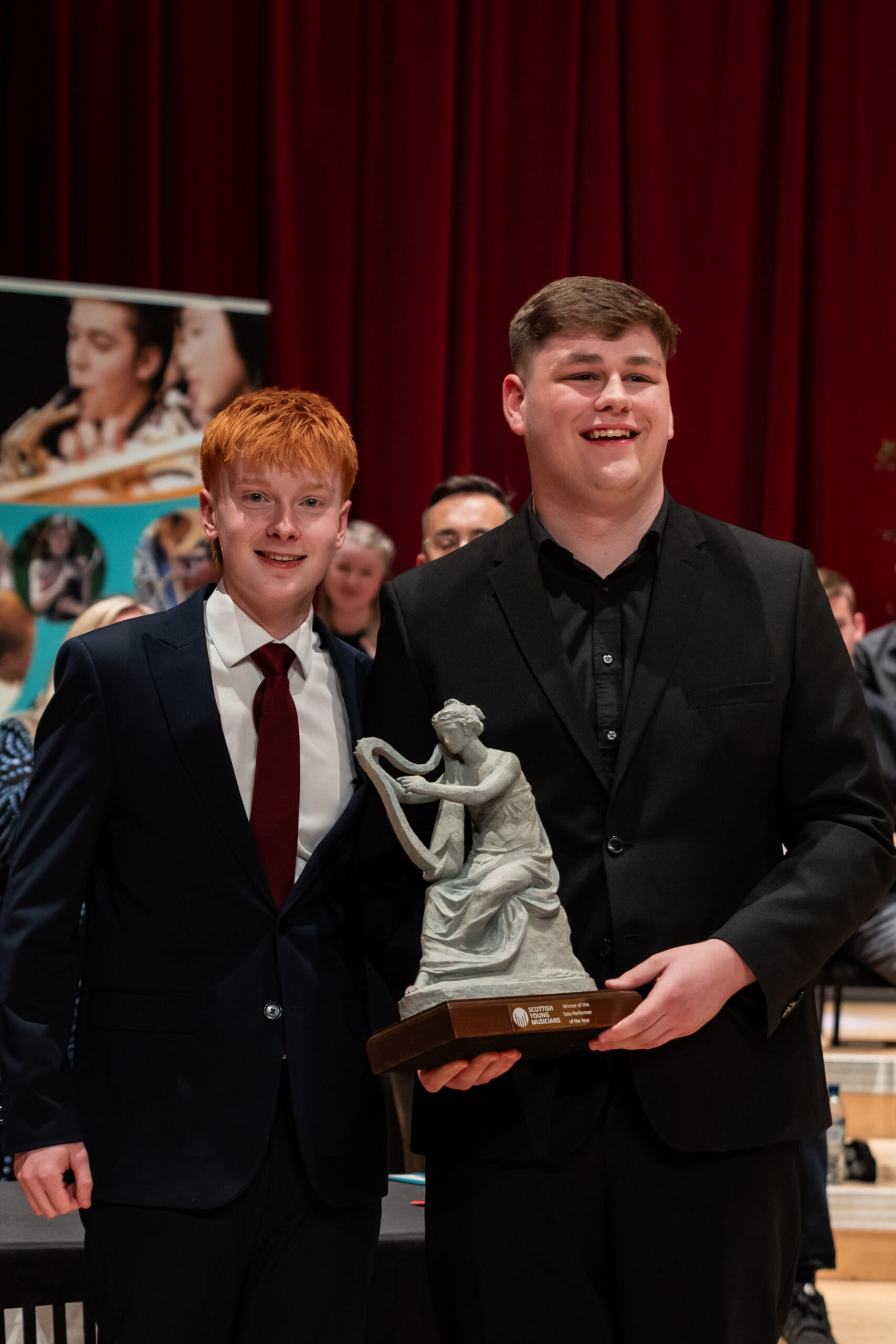 Kai Fitzharris holding the Maid of Morven Trophy after winning Solo Performer of the Year 2026
